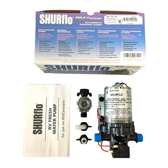 Bomba Shurflo 12V junto a la caja y el manual de instalación