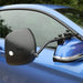 Espejo plano Milenco Grand Aero montado en el retrovisor exterior de un coche azul