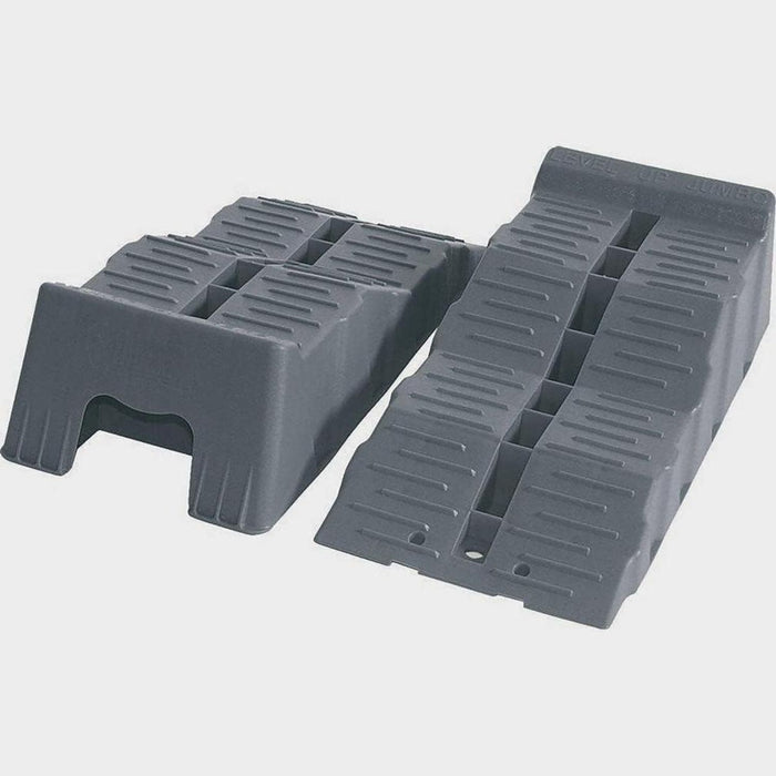 Juego de calzos de nivelación Fiamma Level Up Jumbo en color gris, vistos desde arriba y en posición lateral.